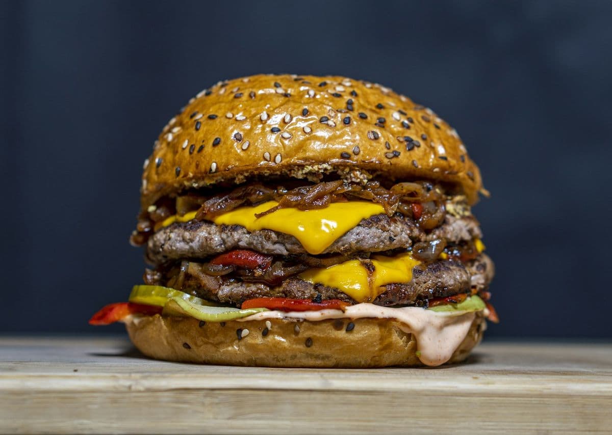 Chapli kabab burger — a flat, crisp-edged kabab patty in a toasted bun