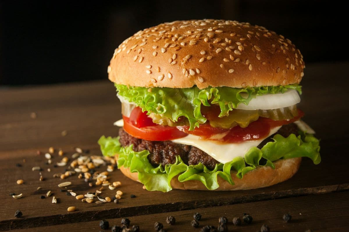 Snacky cheeseburger on a dark board